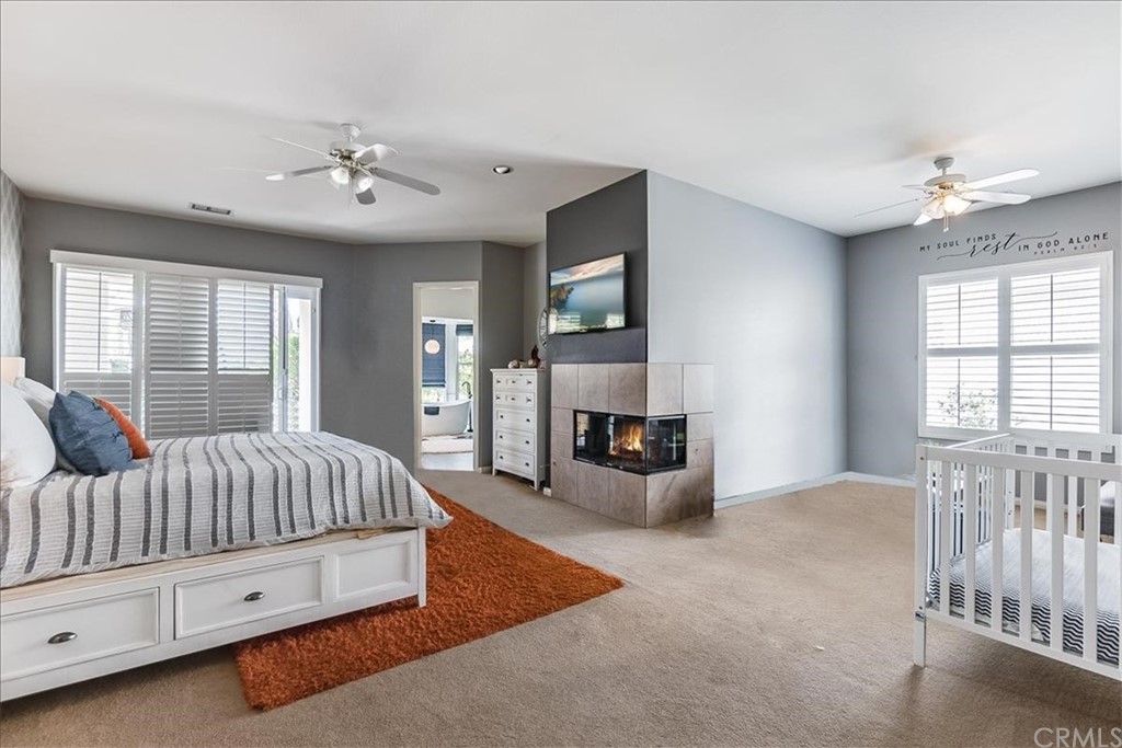 5 Champagne Circle Rancho Mirage, CA 92270 - Photo 20 of 41 a living room with furniture and a chandelier