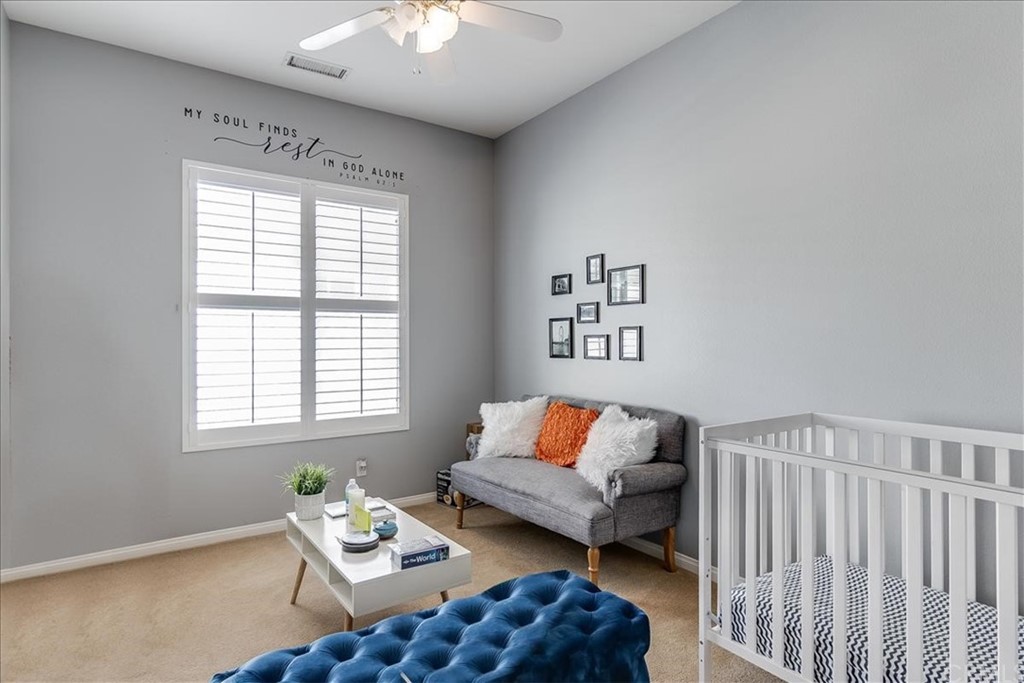 5 Champagne Circle Rancho Mirage, CA 92270 - Photo 22 of 41 a bedroom with furniture and a window