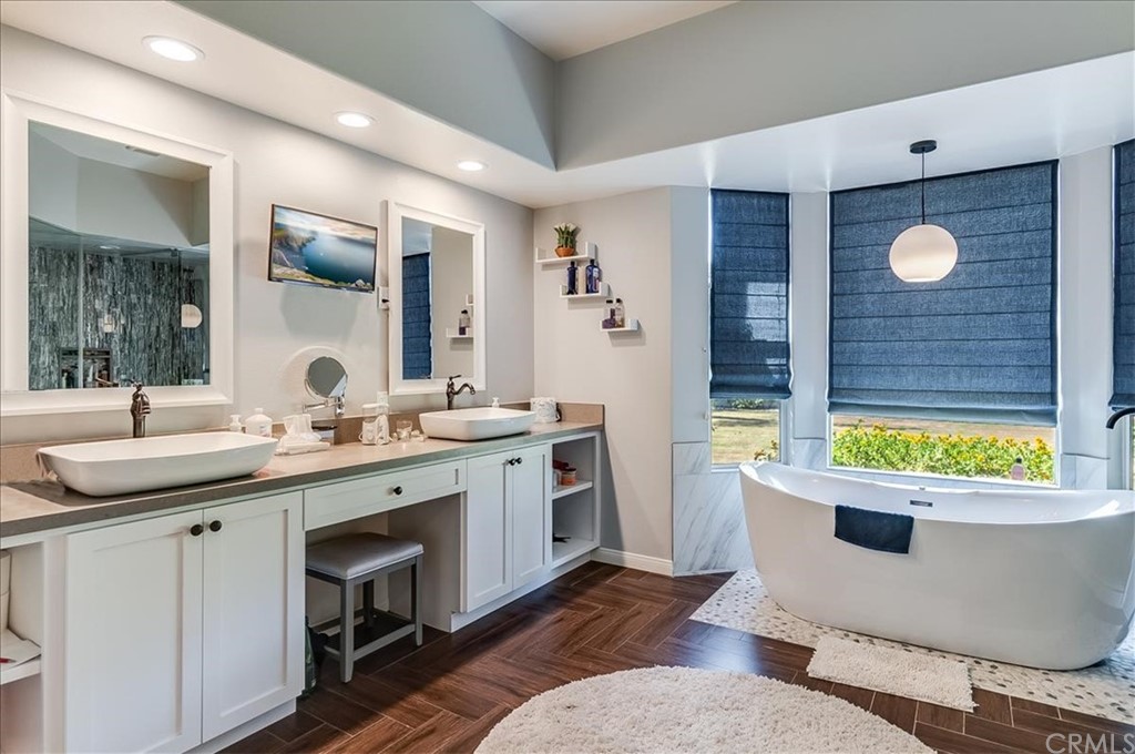 5 Champagne Circle Rancho Mirage, CA 92270 - Photo 24 of 41 a bathroom with a sink and a mirror