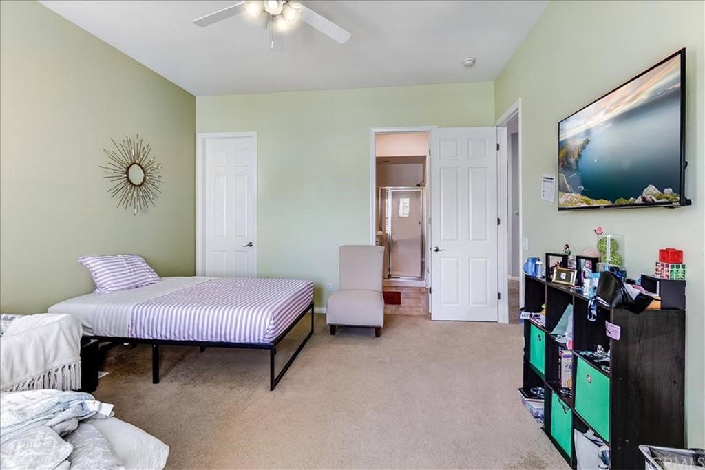 5 Champagne Circle Rancho Mirage, CA 92270 - Photo 27 of 41 a living room with furniture and a flat screen tv
