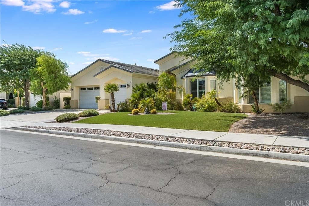 5 Champagne Circle Rancho Mirage, CA 92270 - Photo 4 of 41 a view of a house with a big yard and large trees