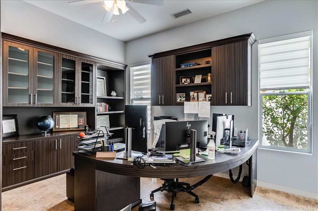 5 Champagne Circle Rancho Mirage, CA 92270 - Photo 32 of 41 a view of a workspace with furniture and a window