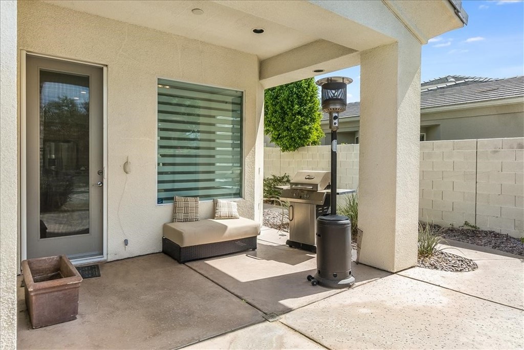 5 Champagne Circle Rancho Mirage, CA 92270 - Photo 33 of 41 a living room with furniture and a window