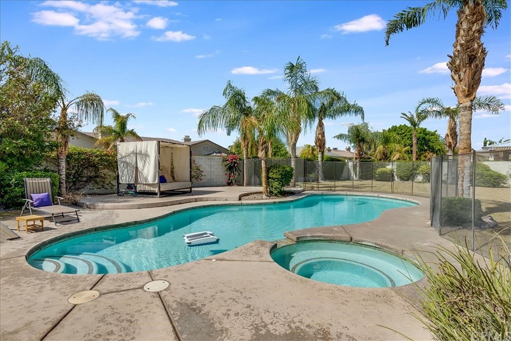 5 Champagne Circle Rancho Mirage, CA 92270 - Photo 37 of 41 a view of a house with swimming pool