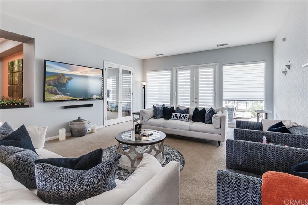 5 Champagne Circle Rancho Mirage, CA 92270 - Photo 7 of 41 a living room with furniture and a flat screen tv