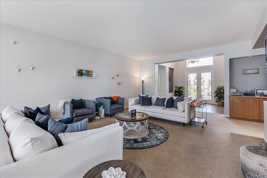 5 Champagne Circle Rancho Mirage, CA 92270 - Photo 8 of 41 a living room with furniture and a large window