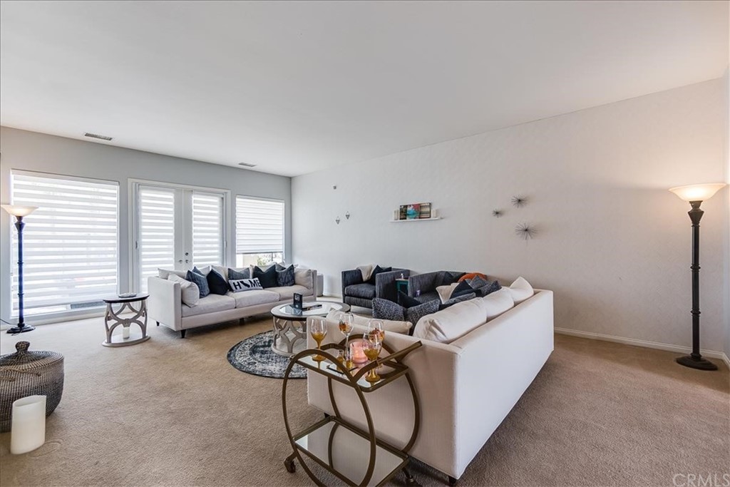 5 Champagne Circle Rancho Mirage, CA 92270 - Photo 9 of 41 a living room with furniture and window