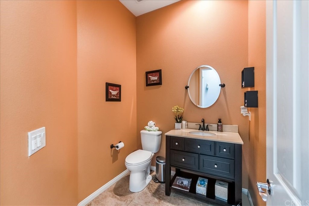 5 Champagne Circle Rancho Mirage, CA 92270 - Photo 10 of 41 a bathroom with a sink and a mirror
