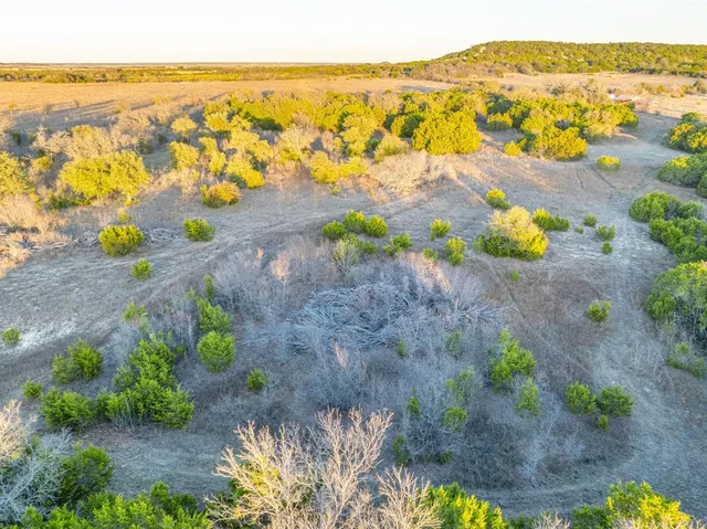 a view of an ocean and a mountain