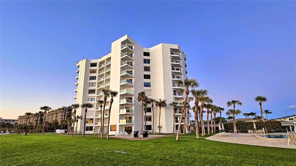 1000 Longboat Club Road, Unit 304 Longboat Key, FL 34228 - Photo 2 of 17 a view of a building with a yard