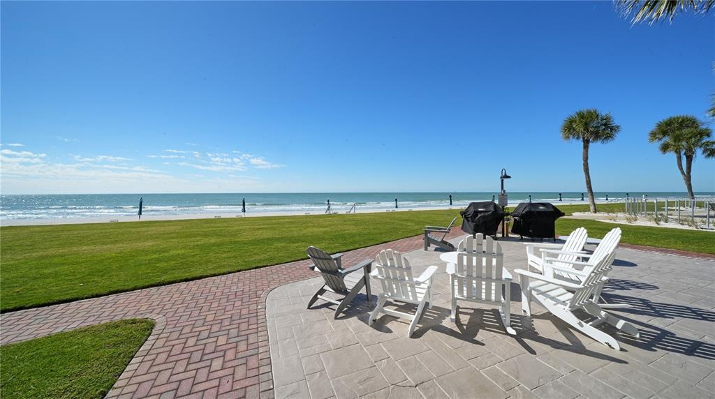 1000 Longboat Club Road, Unit 304 Longboat Key, FL 34228 - Photo 9 of 17 a view of a lake with a table and chairs