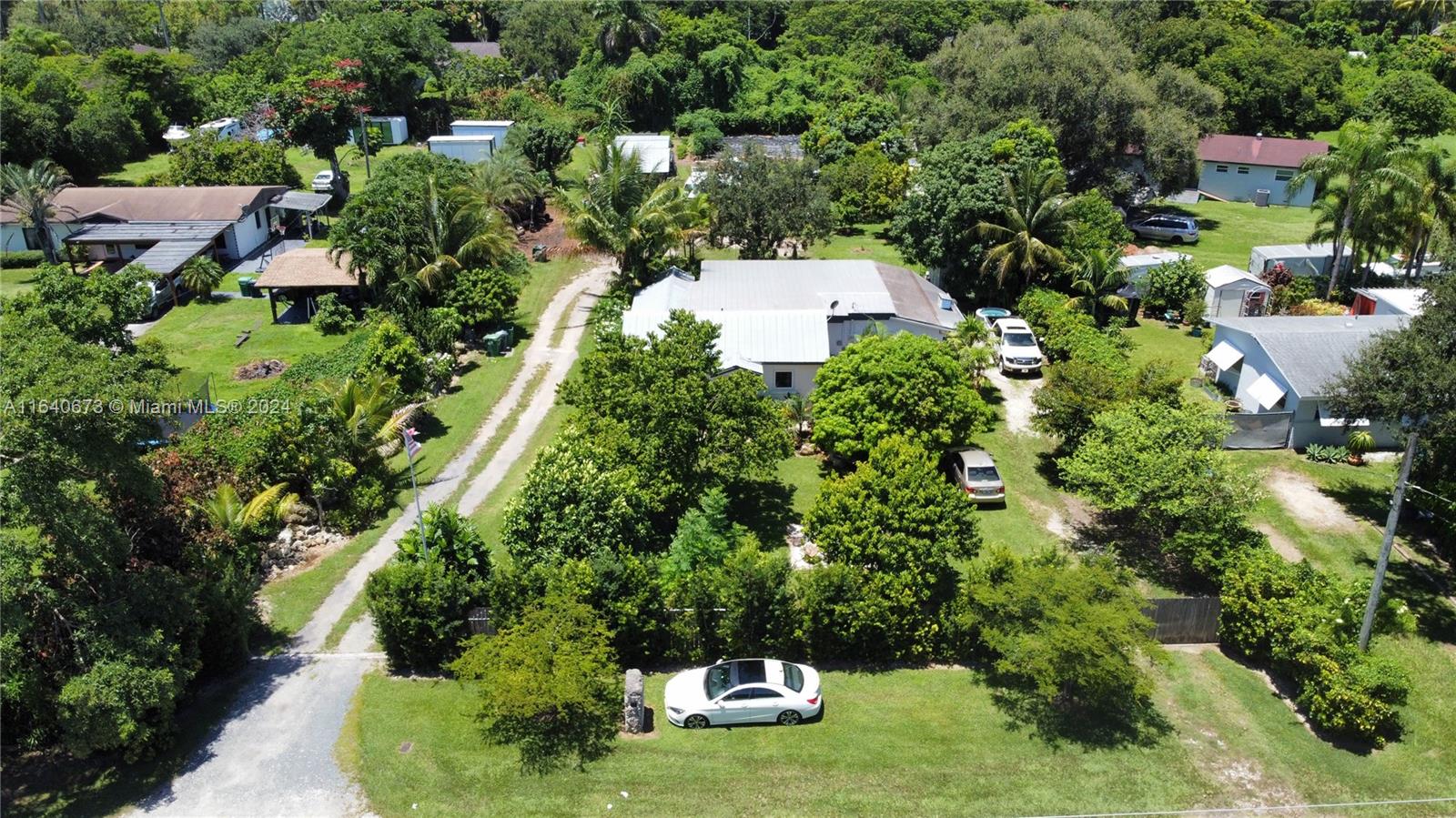 an aerial view of a house with yard swimming pool and outdoor seating