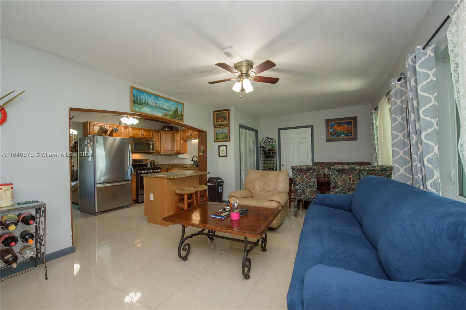 29744 Southwest 170th Avenue Homestead, FL 33030 - Photo 16 of 44 a living room with furniture and a flat screen tv