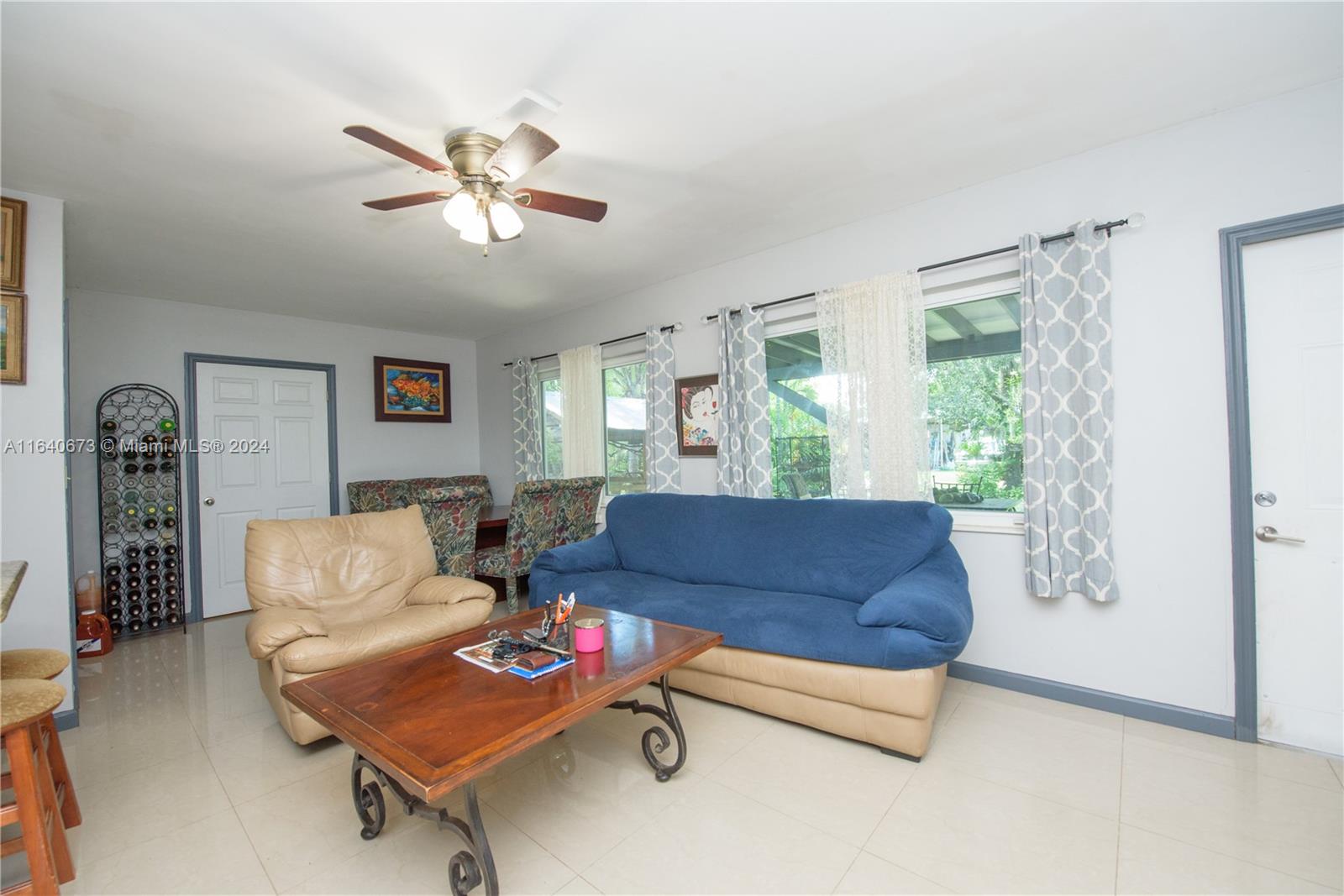 29744 Southwest 170th Avenue Homestead, FL 33030 - Photo 17 of 44 a living room with furniture and a window