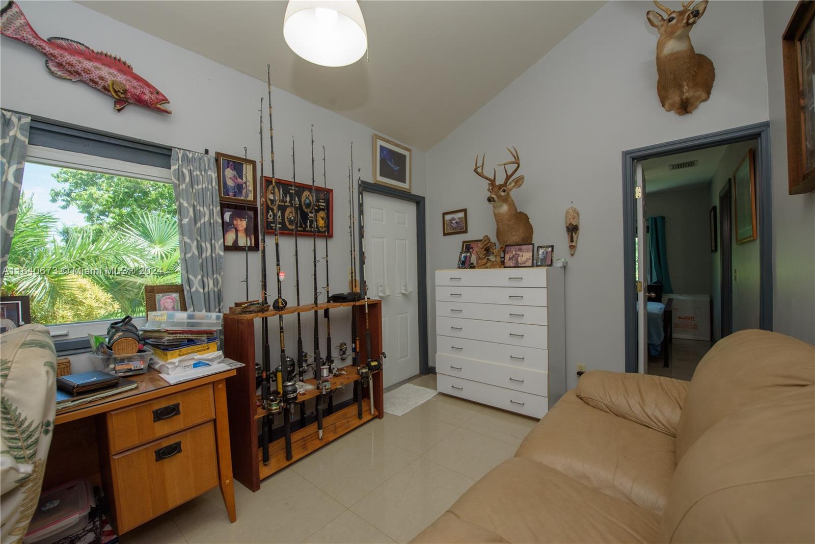 29744 Southwest 170th Avenue Homestead, FL 33030 - Photo 18 of 44 a living room with furniture and a window