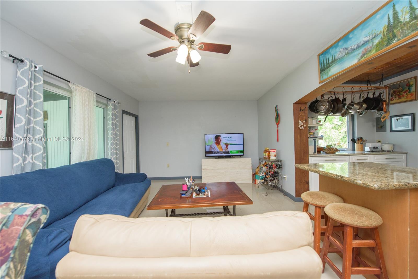 29744 Southwest 170th Avenue Homestead, FL 33030 - Photo 20 of 44 a living room with furniture and a large window