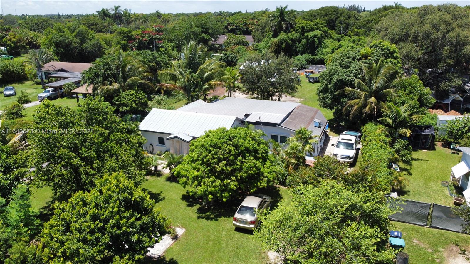 29744 Southwest 170th Avenue Homestead, FL 33030 - Photo 2 of 44 an aerial view of a house with a yard