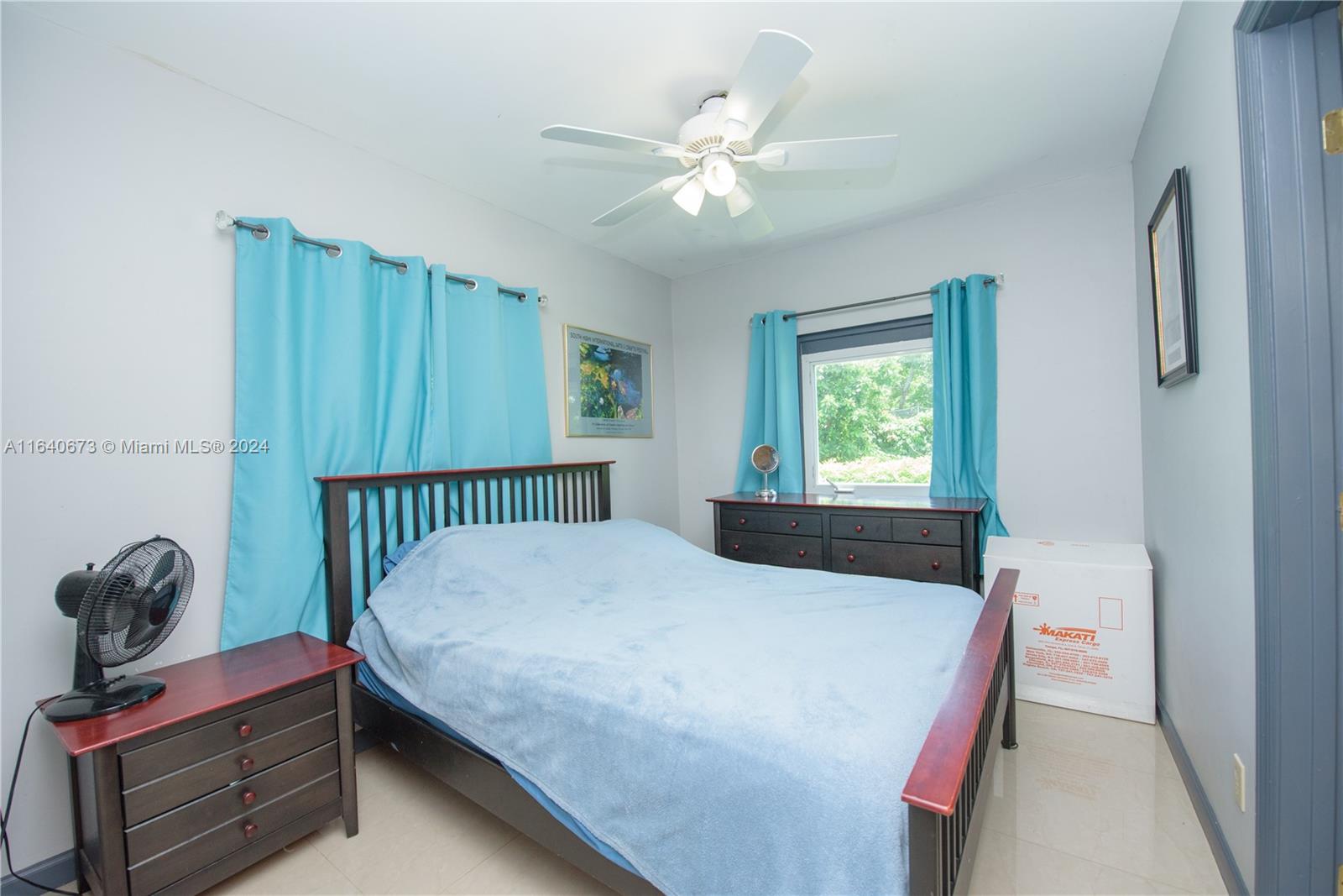 29744 Southwest 170th Avenue Homestead, FL 33030 - Photo 21 of 44 a bedroom with a bed and a window
