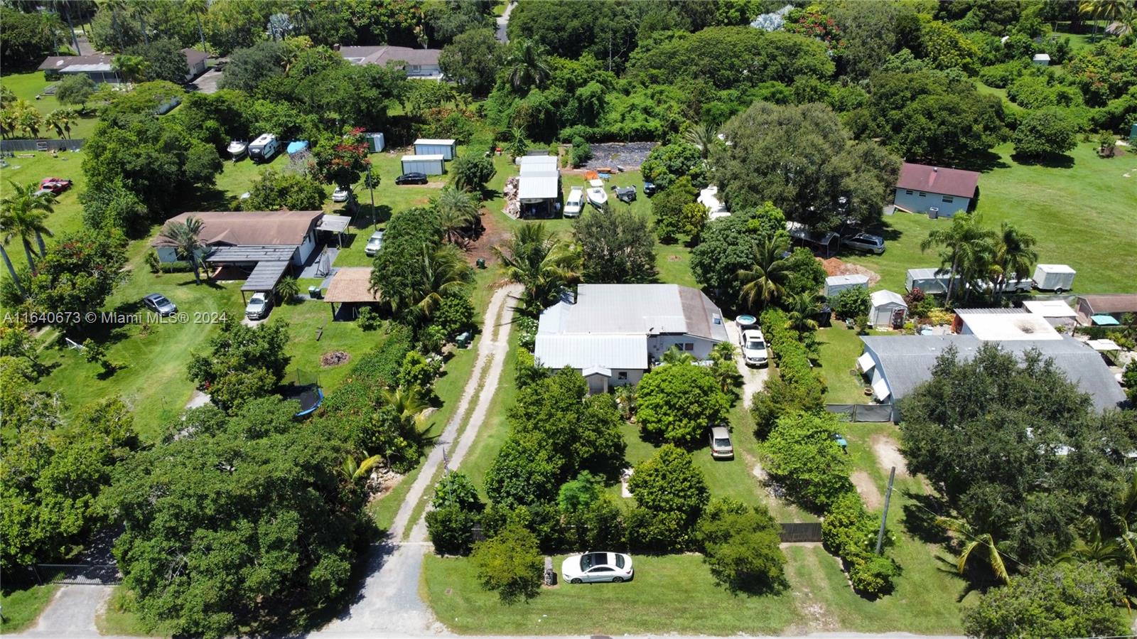29744 Southwest 170th Avenue Homestead, FL 33030 - Photo 32 of 44 an aerial view of residential house with outdoor space and street view