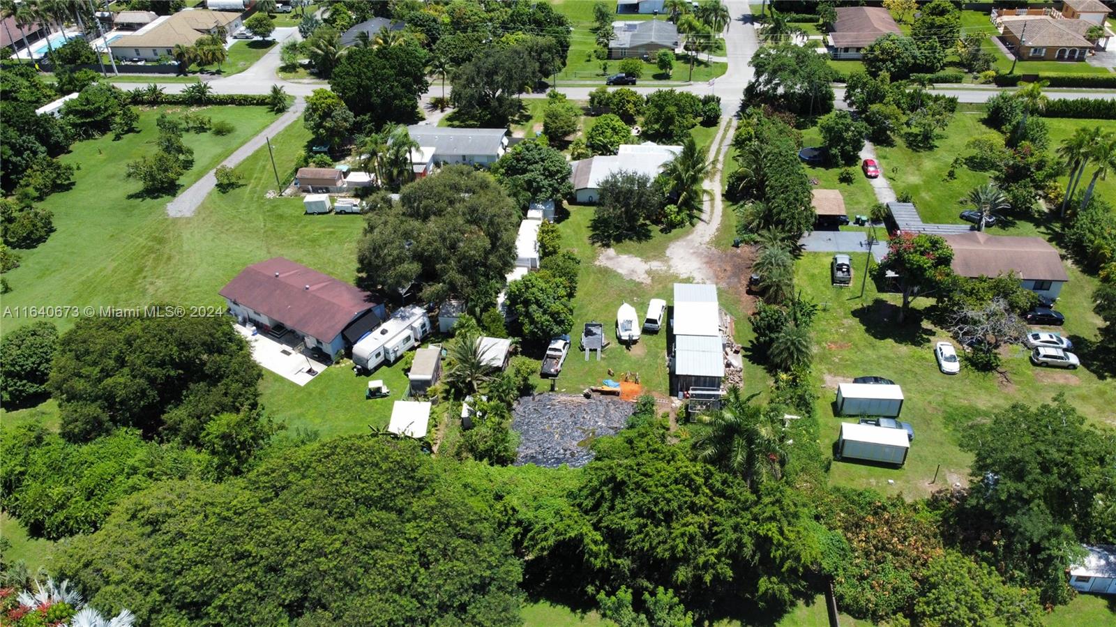 29744 Southwest 170th Avenue Homestead, FL 33030 - Photo 33 of 44 an aerial view of residential house with outdoor space and trees all around