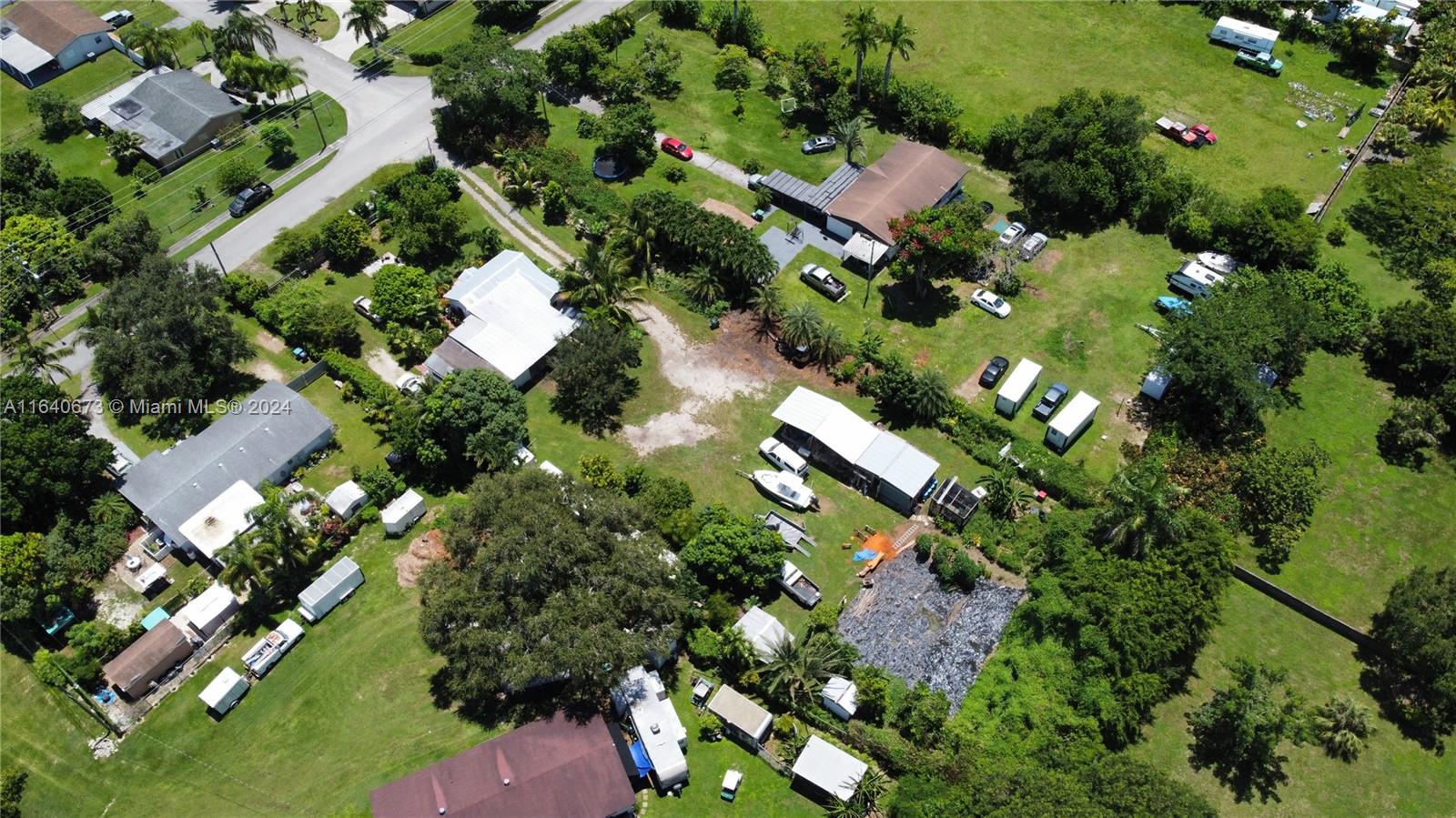 29744 Southwest 170th Avenue Homestead, FL 33030 - Photo 35 of 44 an aerial view of residential houses with outdoor space