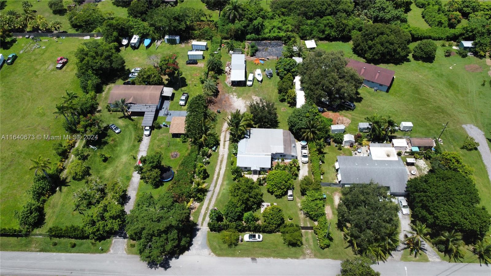 29744 Southwest 170th Avenue Homestead, FL 33030 - Photo 38 of 44 an aerial view of residential house with outdoor space and street view