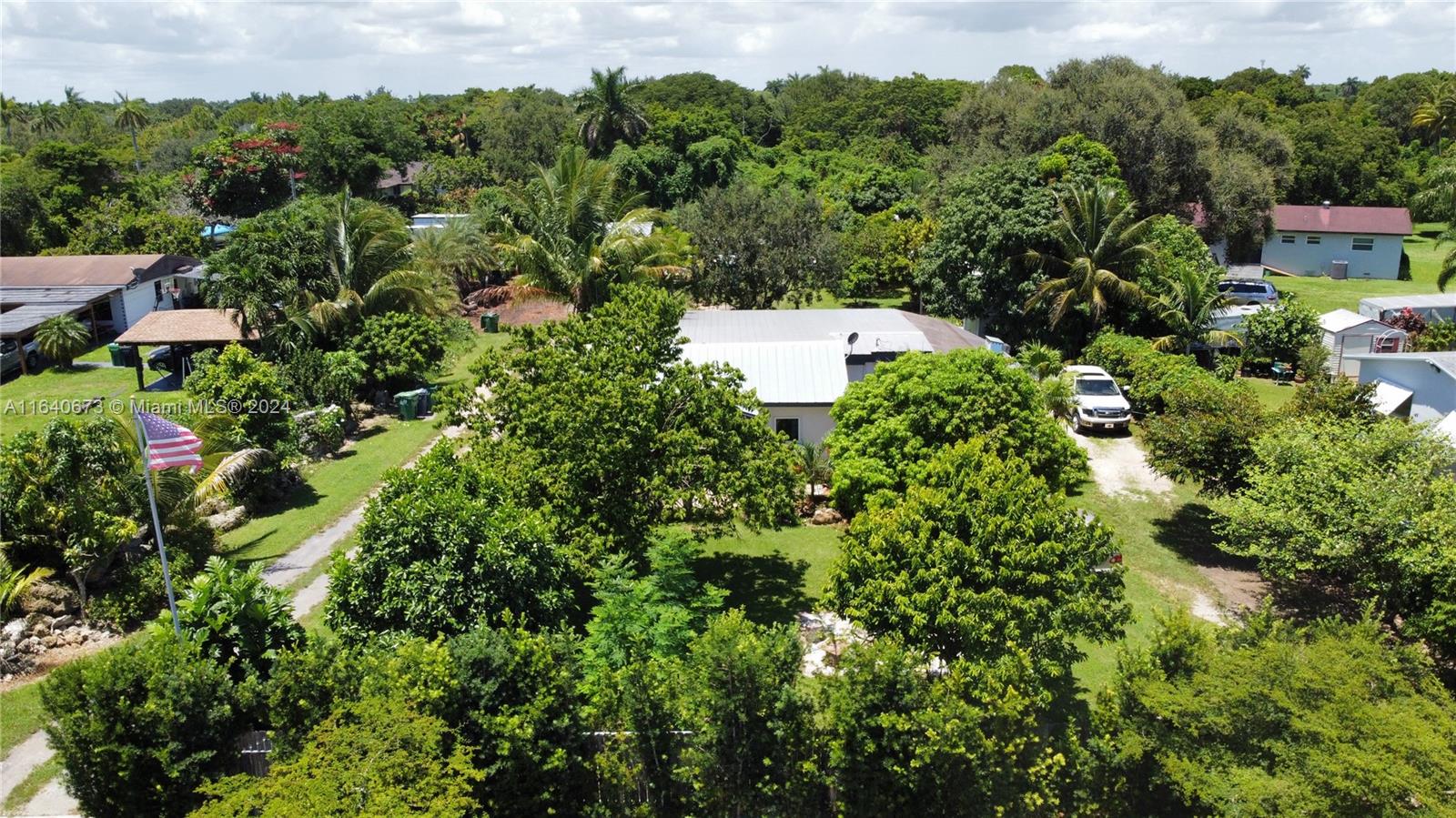 29744 Southwest 170th Avenue Homestead, FL 33030 - Photo 39 of 44 an aerial view of residential house with outdoor space and trees all around