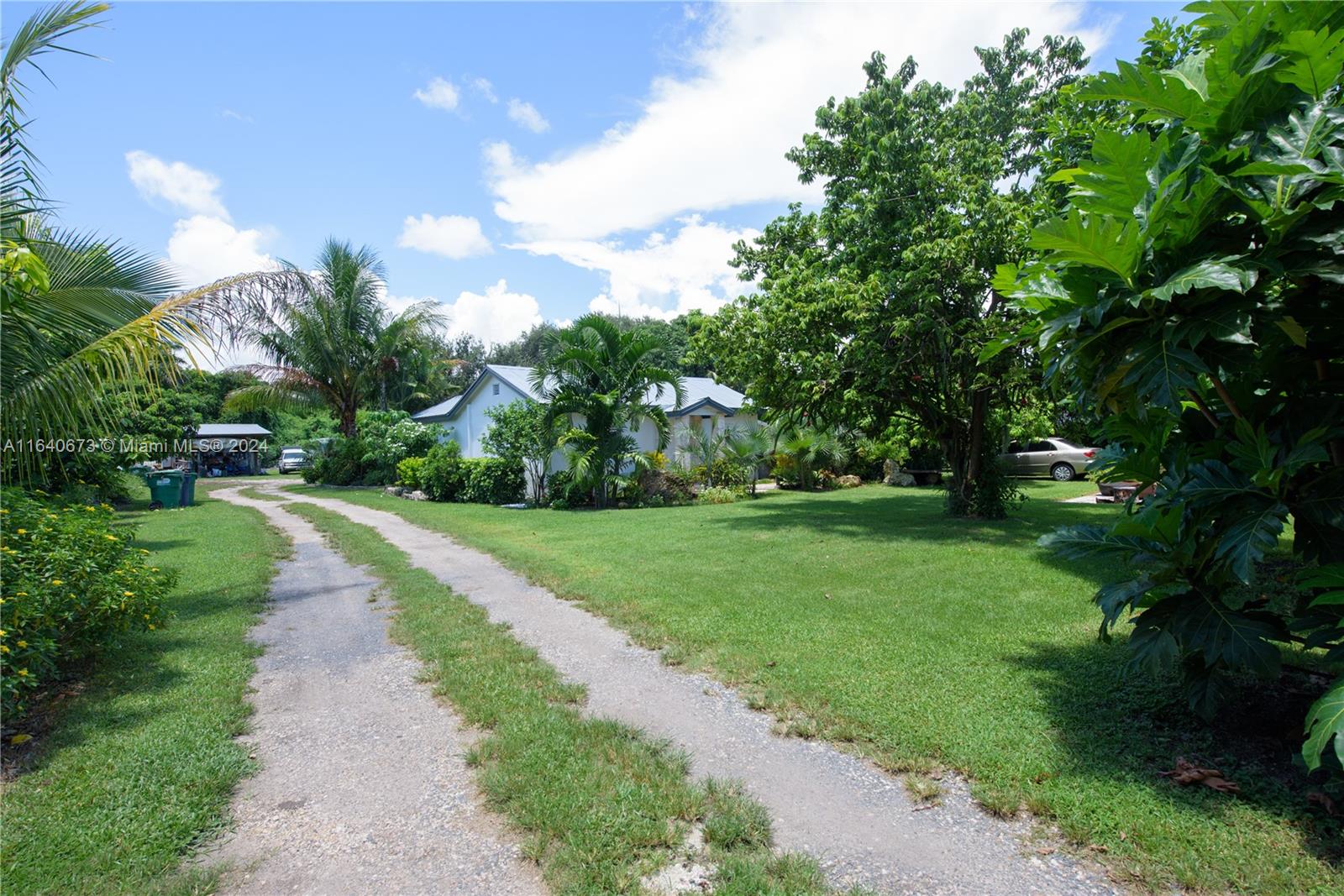 29744 Southwest 170th Avenue Homestead, FL 33030 - Photo 4 of 44 a view of a road with a yard