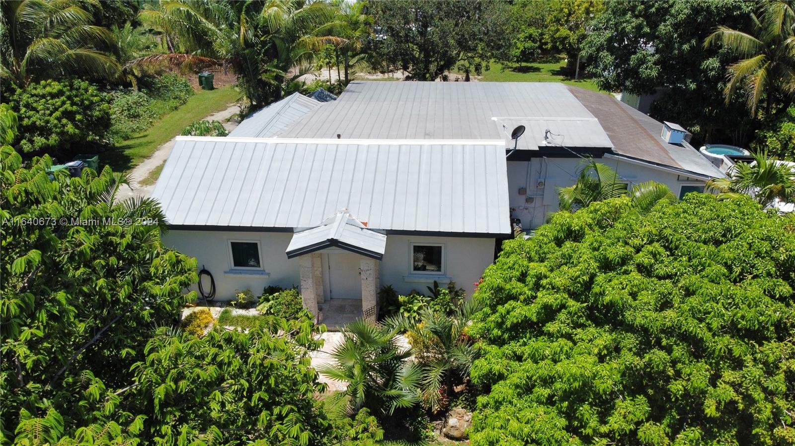 29744 Southwest 170th Avenue Homestead, FL 33030 - Photo 44 of 44 an aerial view of a house and yard and trees all around