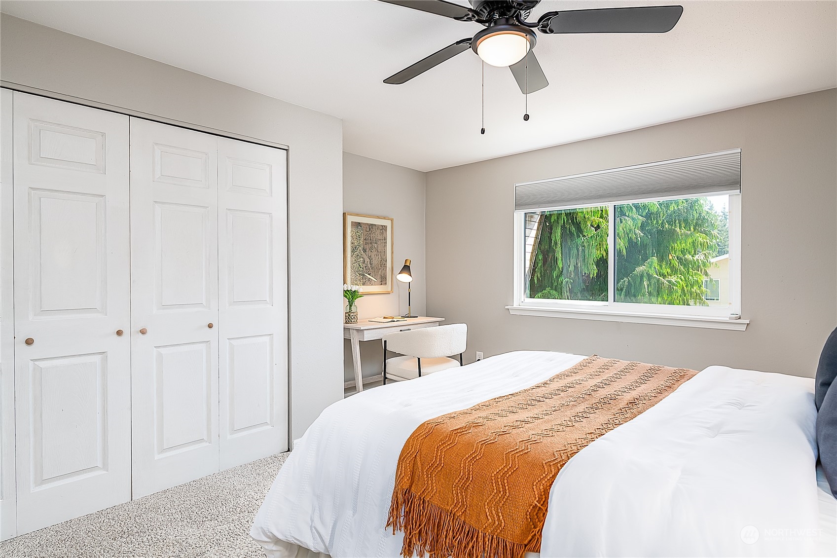 20620 76th Avenue West, Unit D Edmonds, WA 98026 - Photo 12 of 30 a bedroom with a large bed and a chandelier