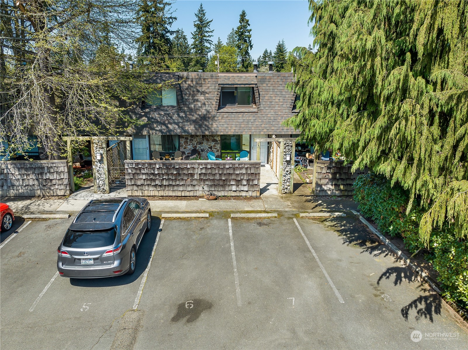 20620 76th Avenue West, Unit D Edmonds, WA 98026 - Photo 24 of 30 a view of a patio with table and chairs and potted plants