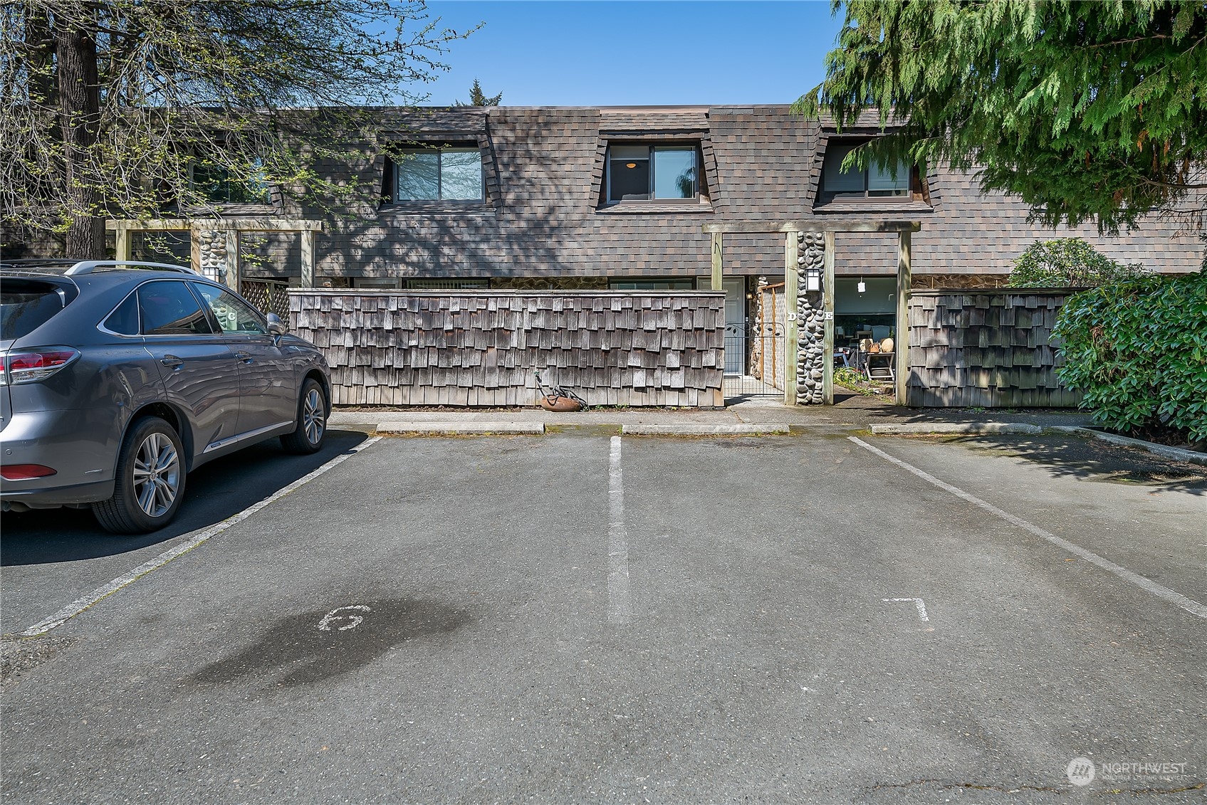 20620 76th Avenue West, Unit D Edmonds, WA 98026 - Photo 25 of 30 a view of a car parked in front of a house