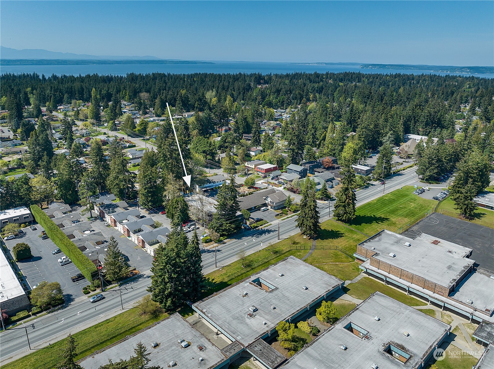 20620 76th Avenue West, Unit D Edmonds, WA 98026 - Photo 29 of 30 an aerial view of a city with lots of residential buildings ocean and mountain view in back