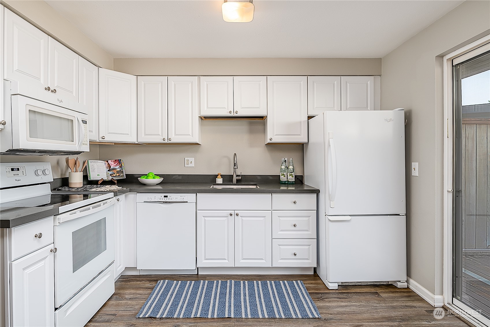 20620 76th Avenue West, Unit D Edmonds, WA 98026 - Photo 9 of 30 a kitchen with cabinets appliances and a counter space