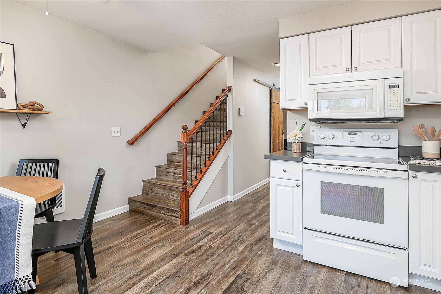 20620 76th Avenue West, Unit D Edmonds, WA 98026 - Photo 10 of 30 a open kitchen with white cabinets and white appliances