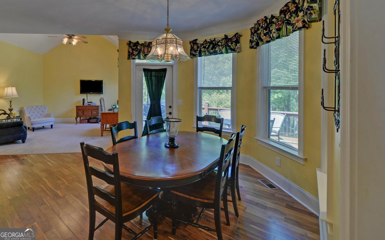 227 Capri Drive Hartwell, GA 30643 - Photo 13 of 75 a view of a dining room with furniture window and wooden floor