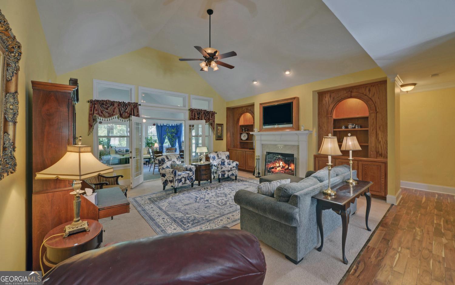 227 Capri Drive Hartwell, GA 30643 - Photo 16 of 75 a living room with furniture and a fireplace