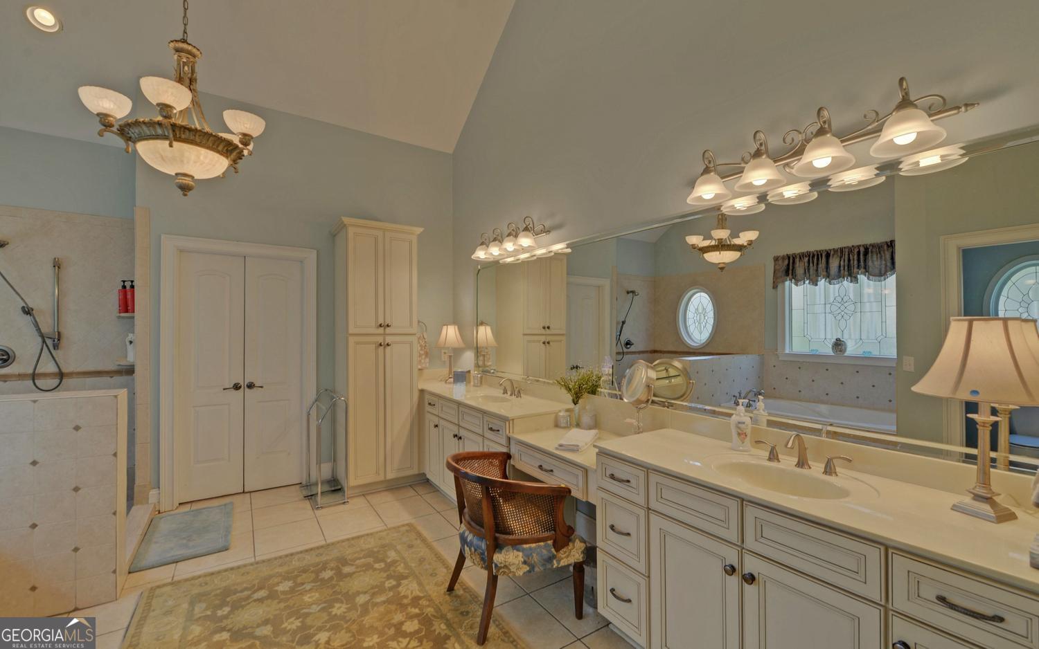 227 Capri Drive Hartwell, GA 30643 - Photo 25 of 75 a bathroom with a double vanity sink and a mirror