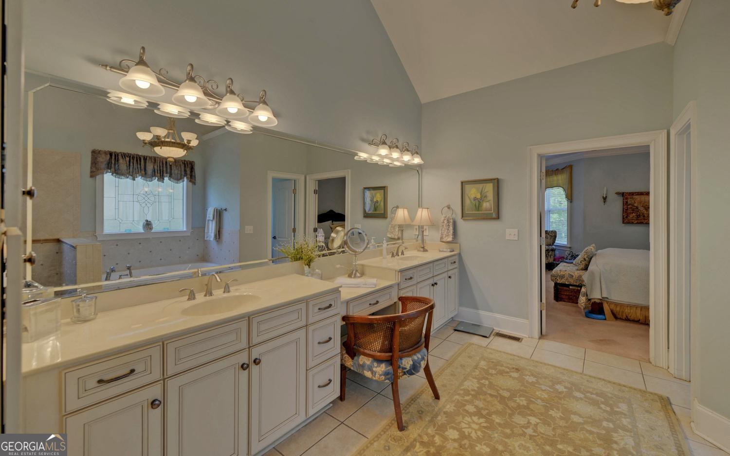 227 Capri Drive Hartwell, GA 30643 - Photo 27 of 75 a spacious bathroom with a sink a large mirror and a shower