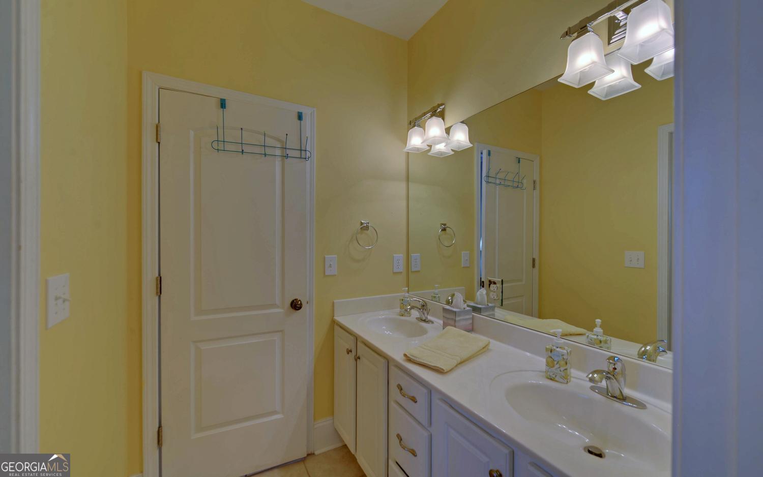 227 Capri Drive Hartwell, GA 30643 - Photo 36 of 75 a bathroom with a sink vanity and a mirror