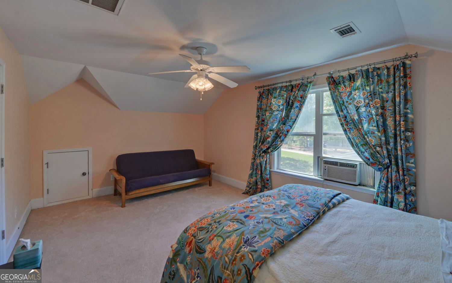 227 Capri Drive Hartwell, GA 30643 - Photo 45 of 75 a bedroom with a bed and a window