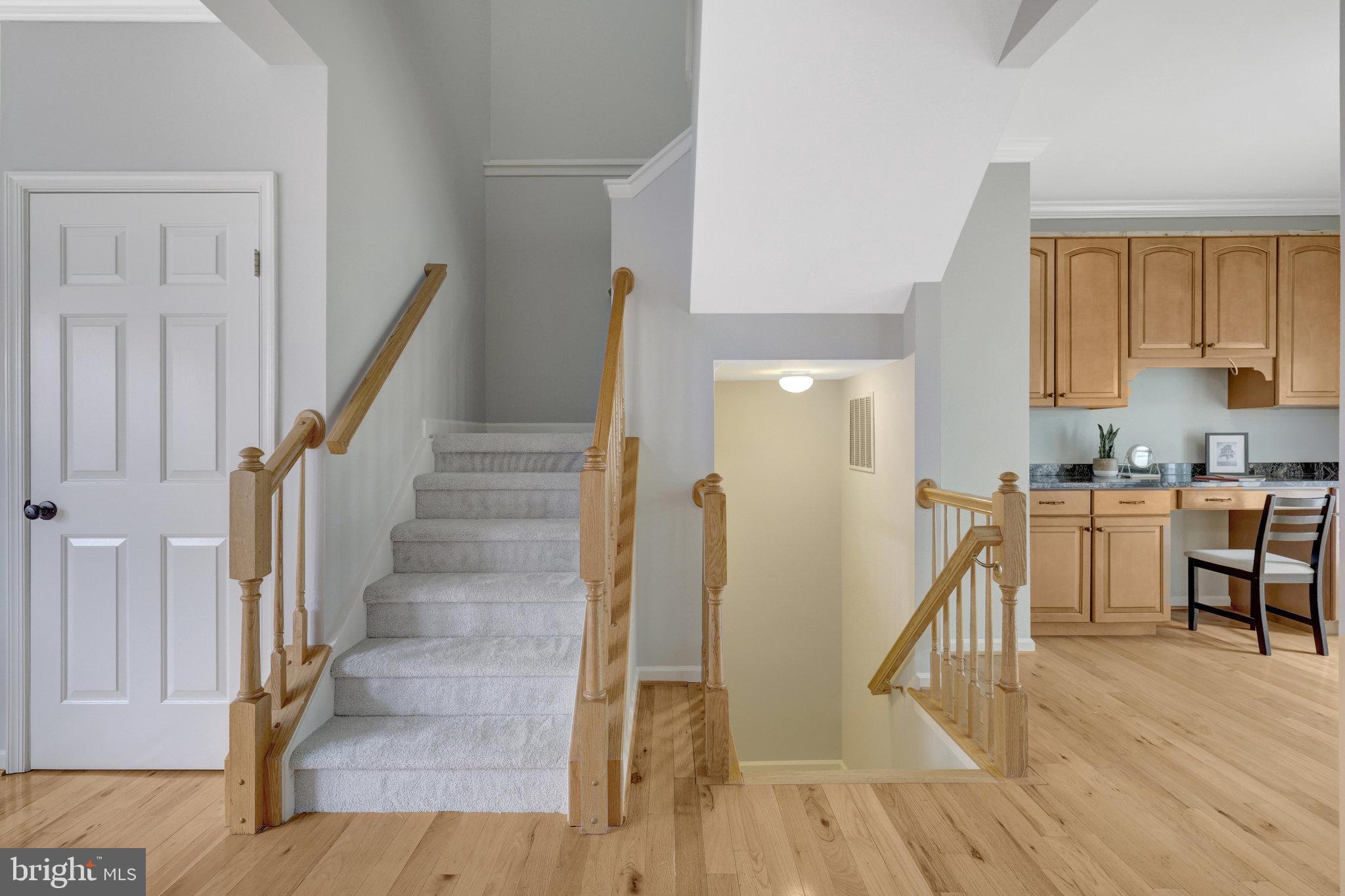 43233 Stillforest Terrace Ashburn, VA 20147 - Photo 11 of 24 a view of entryway and kitchen with wooden floor