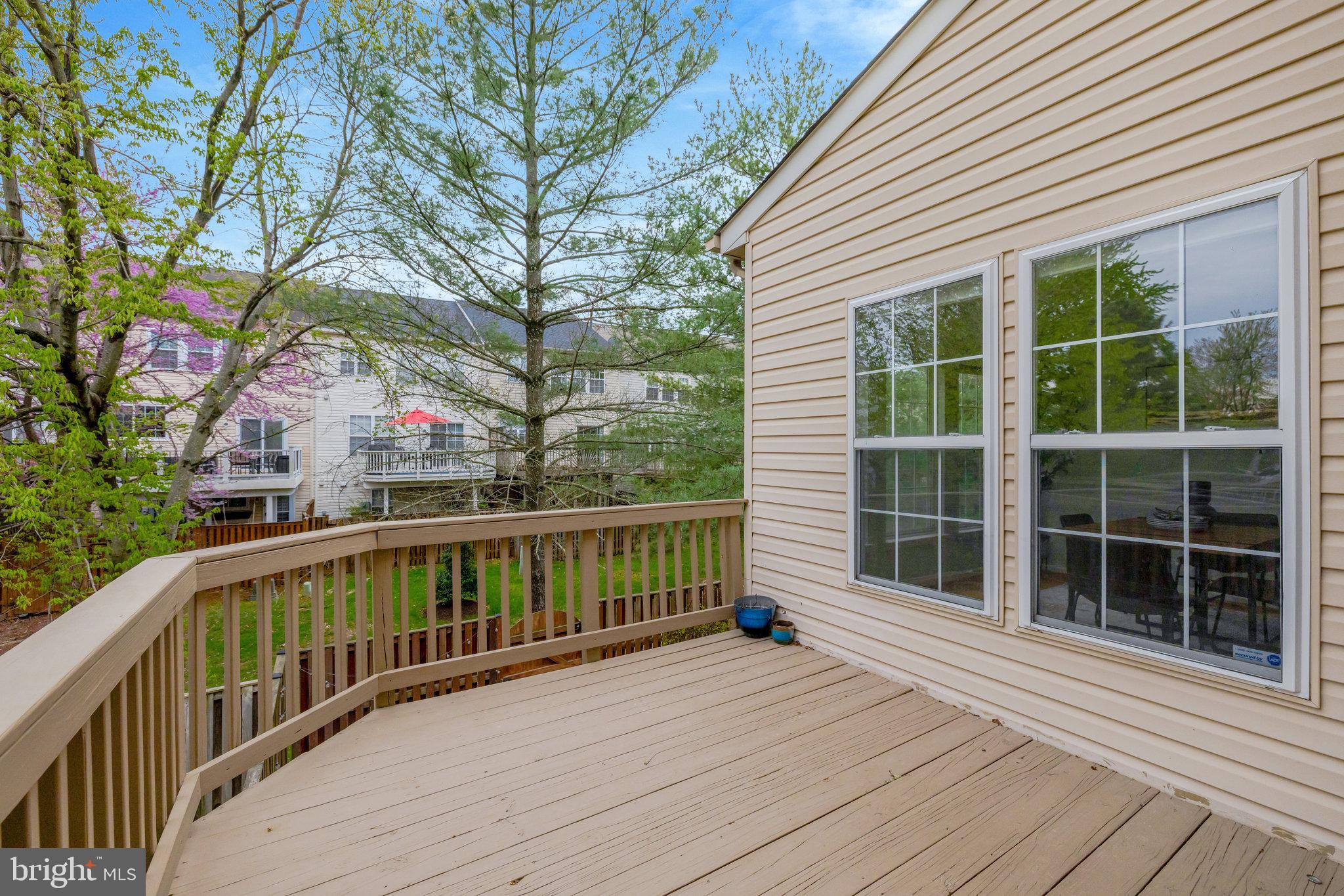 43233 Stillforest Terrace Ashburn, VA 20147 - Photo 12 of 24 a view of a house with a deck