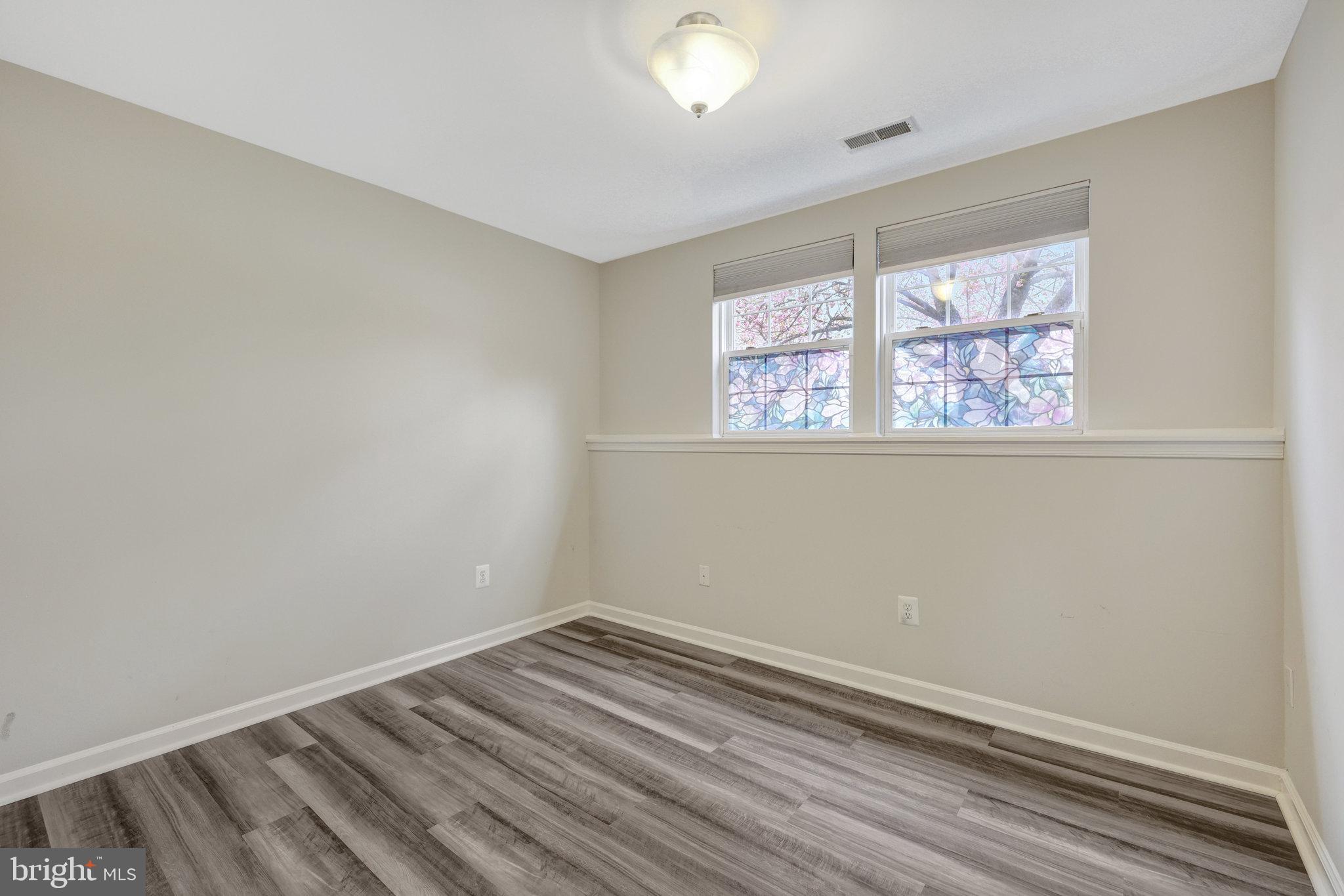 43233 Stillforest Terrace Ashburn, VA 20147 - Photo 23 of 24 an empty room with a window