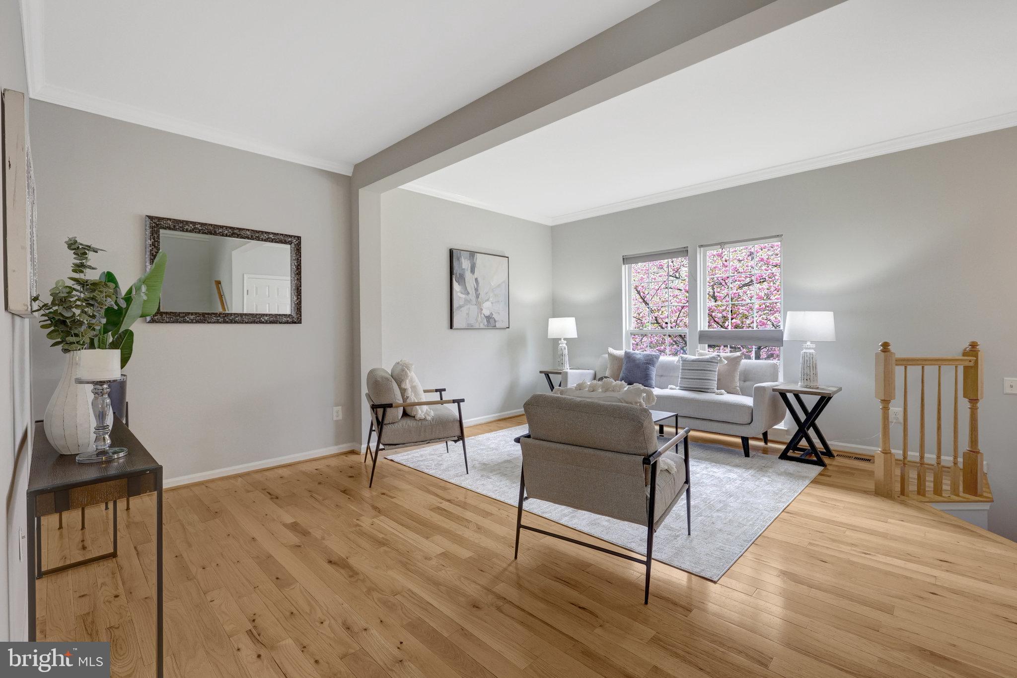 43233 Stillforest Terrace Ashburn, VA 20147 - Photo 3 of 24 a living room with furniture and a wooden floor