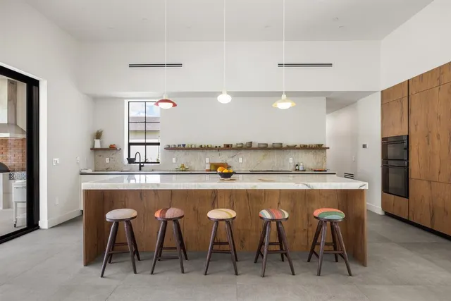a kitchen with stainless steel appliances a sink and counter space