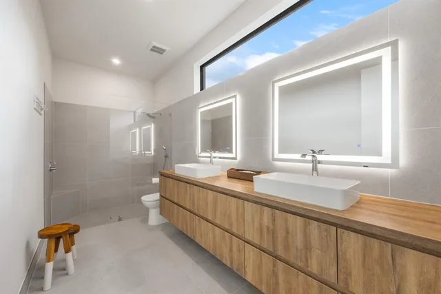 a bedroom with bed and a tv