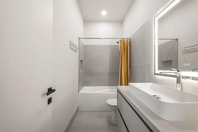 a bathroom with a sink and mirror