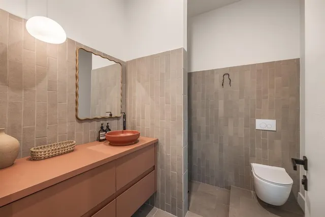 an aerial view of residential houses with outdoor space and swimming pool