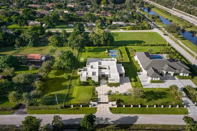 an aerial view of a house with a garden